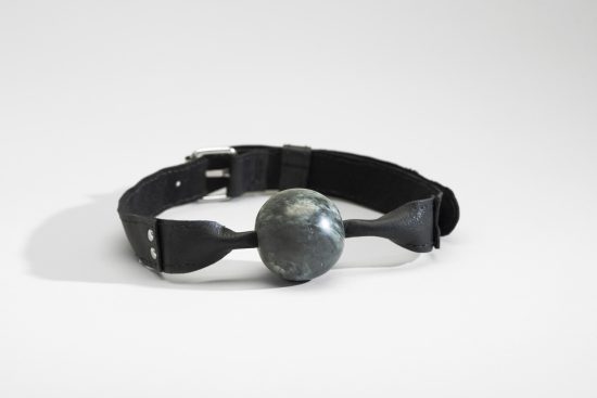 Kablusiak | Ball Gag | 2022 | soapstone, tung oil, metal hardware, leather + artificial sinew | 5.5 x 3.25 in.